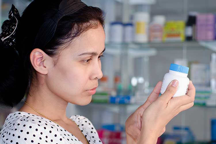 carer checking medication name