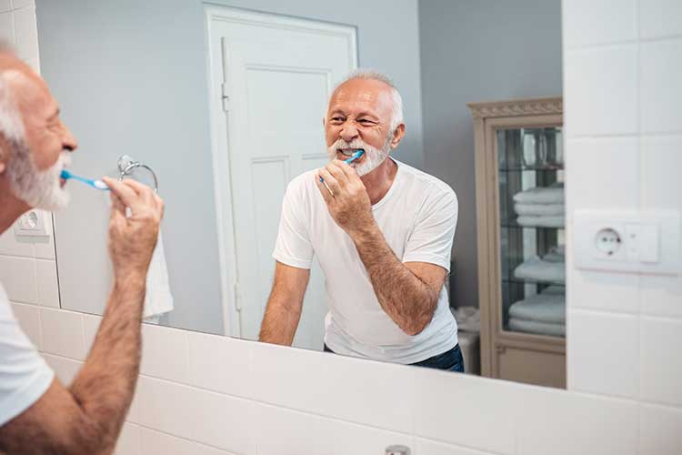basic activities of daily living man brushing teeth