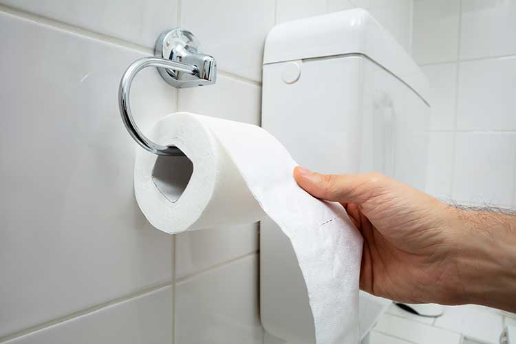 Clostridioides difficile symptoms diarrhoea patient using toilet paper