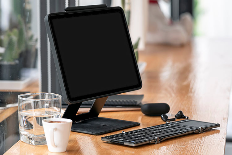 tablet device on raised stand with external keyboard